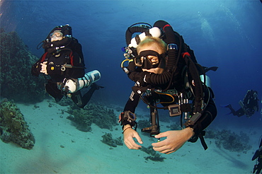 Mixed gas rebreather divers showing equipment.  Red Sea.