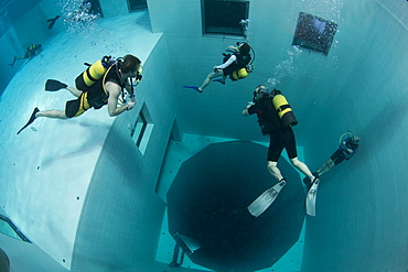 Divers in Nemon 33 pool, the deepest swimming pool in Europe, Belguim, Europe