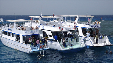 Red Sea diving boats moors on reef near Hurghada. Egypt