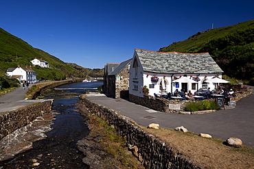 The Harbour Light Cafe, built originally in the 16th-century, but destroyed in floods in 2004 and rebuilt April 2006) and Valency River outlet, Boscastle Harbour, Valency Valley. Boscastle, Cornwall, England, United Kingdom, Europe