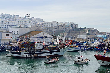 Fishing boats leaving Tangier fishing harbour, Tangier, Morocco, North Africa, Africa