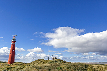 View with Red Lighthouse, over sand dunes and heathland, Schiermonnikoog, West Frisian Islands, The Netherlands (Holland), Europe