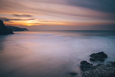 Porthtowan beach looking along the Cornish coastline at sunset, Porthtowan, Cornwall, England, United Kingdom, Europe 