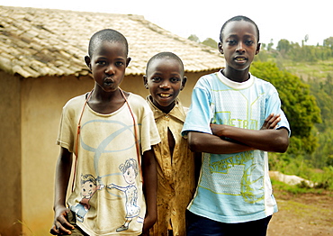 Three friends standing together in the countrysied of Rwanda, Africa. Gikongoro, Rwanda, East Africa