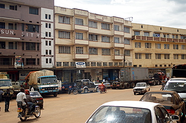 One of the streets in the commercial centre of Kampala.  One of the most concentrated areas in the City with narrow streets and high buildings. Kampala, Uganda, East Africa