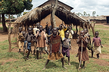 An IDP camp (internally displaced people) in Amuru district of Northern Uganda has been created to accommodate the mass of Ugandan refugees fleeing the LRA (Lords Resistance Army) who are fighting the Ugandan government and its people.  Here are some of the many children from the camp showing off in front of camera. Amuru, Uganda, East Africa