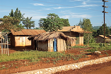 Slightly more advanced than 'md huts', This accommodation incorporates brick and corrigated iron.  Sporadically placed on the side of the road on the way to JinJa, Uganda. Jinja, Uganda, East Africa