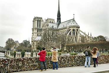 The Love Lock bridge (Pont de l'Archeveche) looking out to Notre Dame, Paris, France, Europe