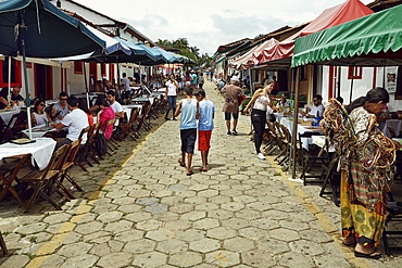 Street lined with outside restaurants in the old town of Pirenopolis, in the Brazilian state of Goias, Brazil, South America