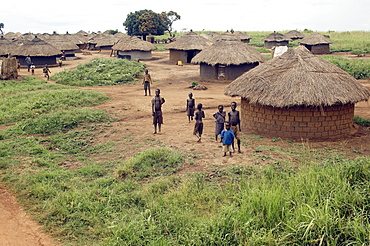 An IDP camp (internally displaced people) in Amuru district of Northern Uganda has been created to accommodate the mass of Ugandan refugees fleeing the LRA (Lords Resistance Army) who are fighting the Ugandan government and its people.  Accommodation are basic mud huts, but always well kept. Amuru, Uganda, East Africa