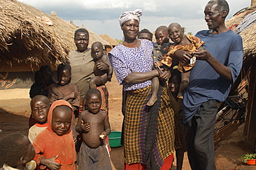 An IDP camp (internally displaced people) in Te-Tugu district of Northern Uganda has been created to accommodate the mass of Ugandan refugees fleeing the LRA (Lords Resistance Army) who are fighting the Ugandan government and its people.  Children are plentiful in these camps and are far safer here than neighbouring villages. Te-Tugu, Uganda, East Africa