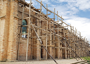 Kabgayi, Rwanda has the oldest Cathedral in the Country (1925).  Restoration work is underway and scaffolding is a rather basic if not intricate combination of tree branches and sawn wood planks.  An art form all to itself. Kabgayi, Rwanda, East Africa