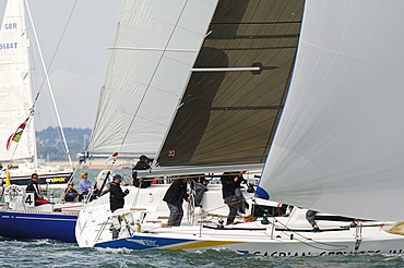 Action dropping the Spinnaker at Skandia Cowes Week 2008 Finish Line