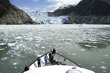 Working a boat through the ice of the Sawyer Glacier, a tidewater glacier at the end of Tracy Arm in Southeast Alaska, USA. 