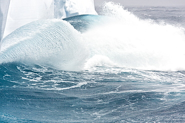 Massive waves breaking on iceberg detail in and around the Antarctic Peninsula during the summer months