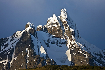 Sunset on snow-capped mountain peaks that are a part of the Andes Mountains just outside Ushuaia, Argentina.