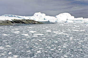 Huge icebergs and brash ice near Petermann Island on the west side of the Antarctic Peninsula.