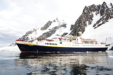 The National Geographic Endeavour pushing through brash ice and small icebergs in the Lemaire Channel near the Antarctic Peninsula.