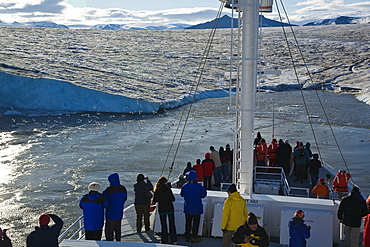 Late evening view from the National Geographic Endeavour of the Negrebreen Glacier melting in the sunlight on Spitsbergen Island in the Svalbard Archipelago, Barents Sea, Norway.