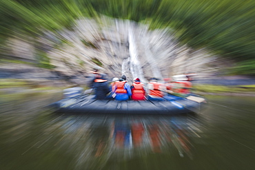 Fun visual effects of eco-tourists in a Zodiac in Kynoch Inlet in Misty Fjords National Monument in Southeast Alaska, USA. Pacific Ocean.