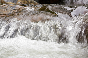 Detail from a waterfall in the small Norwegian summer area in Sandvika Bay on the south side of Svesfjord, Norway.