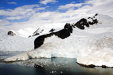 Snow and ice covered mountains in Paradise Bay on the Antarctic Peninsula.