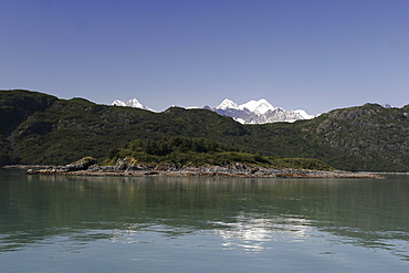 The Fairweather range reflected in the calm waters of the inside passage, Southeast Alaska, USA.