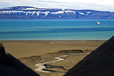 A view of the National Geographic Endeavour from the cliffs at Diskobukta on the western side of EdgeØya in the Svalbard Archipelago in the Barents Sea.