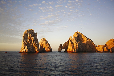 Sunrise on the famous finisterra (land's end) rock formation in Cabo San Lucas, Baja California Sur, Mexico.