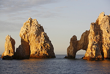 Sunrise on the famous finisterra (land's end) rock formation in Cabo San Lucas, Baja California Sur, Mexico.