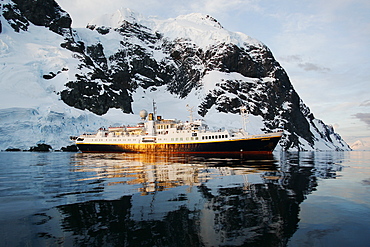 The National Geographic Endeavour at sunset in the Lemaire Channel near the Antarctic Peninsula.