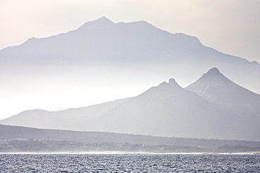 Sunset over the southern Baja Peninsula in Baja California Sur, Mexico. This photo is taken from a boat on the Gulf of California (Sea of Cortez) side of the peninsula.