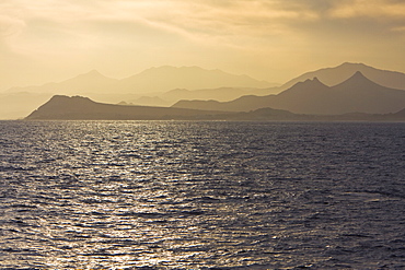 Sunset over the southern Baja Peninsula in Baja California Sur, Mexico. This photo is taken from a boat on the Gulf of California (Sea of Cortez) side of the peninsula.