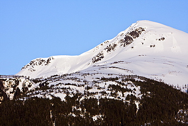 Snow-capped mountain peak on Chichagof Island in the late springtime in Southeast Alaska, USA, Pacific Ocean.