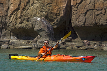 Lindblad Expeditions guest kayaking on Isla Danzante in the middle Gulf of California (Sea of Cortez), Baja California Norte, Mexico. No model or property releases for thi image. 