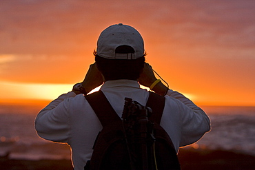 Crew member Juan Carlos Alvia of the Lindblad Expeditions ship the National Geographic Polaris in the waters surrounding the Galapagos Island Archipelago, Ecuador