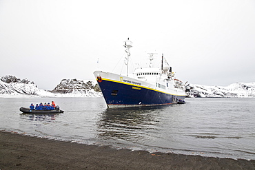 The Lindblad Expedition ship National Geographic Endeavour operating in Whalers Bay inside the caldera of Deception Island in the South Shetland Islands, Antarctica