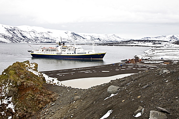 The Lindblad Expedition ship National Geographic Endeavour operating in Whalers Bay inside the caldera of Deception Island in the South Shetland Islands, Antarctica