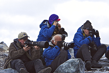 National Geographic photographer Joel Sartore with guests from the Lindblad Expedition ship National Geographic Endeavour on Torgeson Island near the Antarctic Peninsula