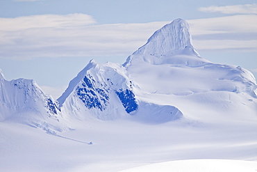 The Lindblad Expeditions ship National Geographic Explorer pushes through ice in Crystal Sound, south of the Antarctic Circle