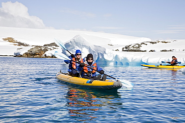 Guests from the Lindblad Expedition ship National Geographic Explorer kayaking in and around the Antarctic Peninsula in the summer months.