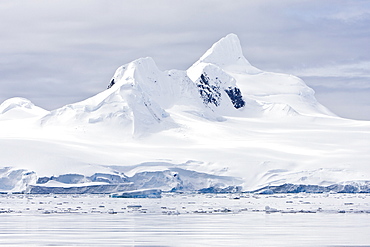 The Lindblad Expeditions ship National Geographic Explorer pushes through ice near Larrouy Island in Grandidier Channel