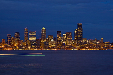 Views at night of downtown Seattle, Washington State, USA. Pacific Ocean.  No model or property releases are available for this image.