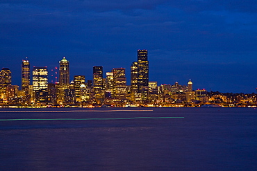 Views at night of downtown Seattle, Washington State, USA. Pacific Ocean.  No model or property releases are available for this image.