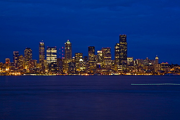 Views at night of downtown Seattle, Washington State, USA. Pacific Ocean.  No model or property releases are available for this image.