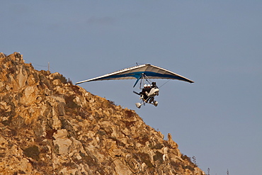 Ultra light flying over Land's End (Finisterra) in Cabo San Lucas, Baja California Sur, Mexico.