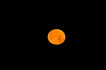 The waxing moon over the Baja Peninsula, Baja California Sur, Mexico.