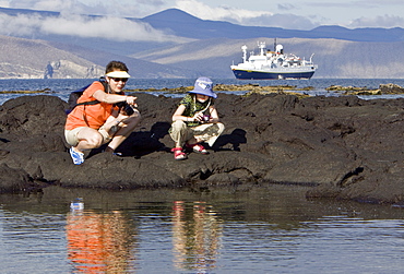 Lindblad Expeditions Guests doing fun and exciting things in the Galapagos Island Archipeligo, Ecuador. Model release number SMB0509.