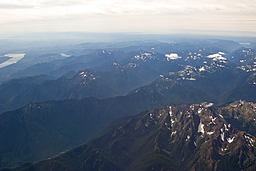 Low clouds and dramatic light flying into Sitka, Southeast Alaska, USA. Pacific Ocean.