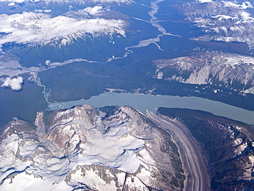 Aerial views of snow-capped mountains, ice fields, and glaciers on a commercial flight from Juneau to Anchorage Alaska, USA, Pacific Ocean